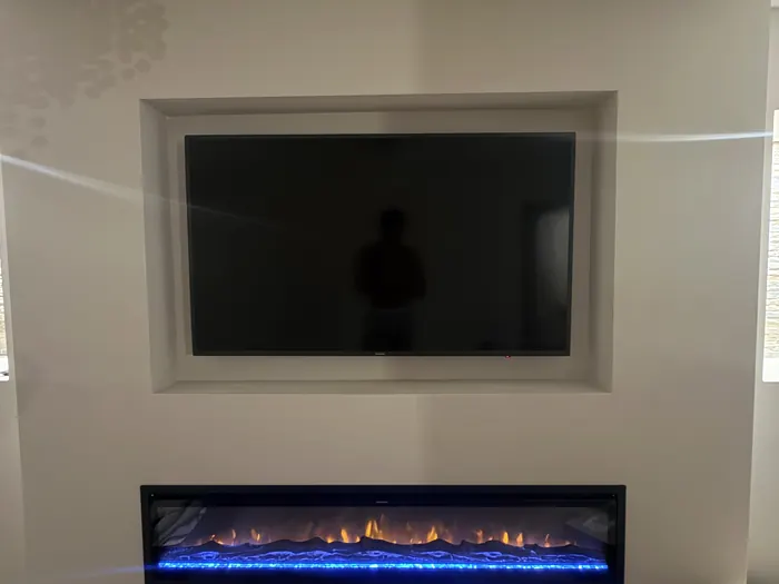 Media wall and feature fire by Cann's Electrical, Cardiff